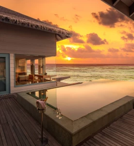 Sunset Over Water Villa with Pool