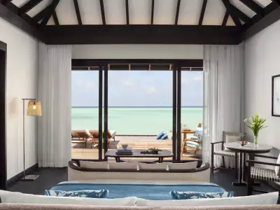 Deluxe Over Water Villa - Bedroom with Lagoon Views