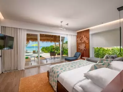 Beach Villa Bedroom Emerald Maldives Resort & Spa